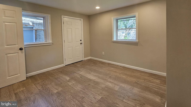 spare room with light hardwood / wood-style flooring