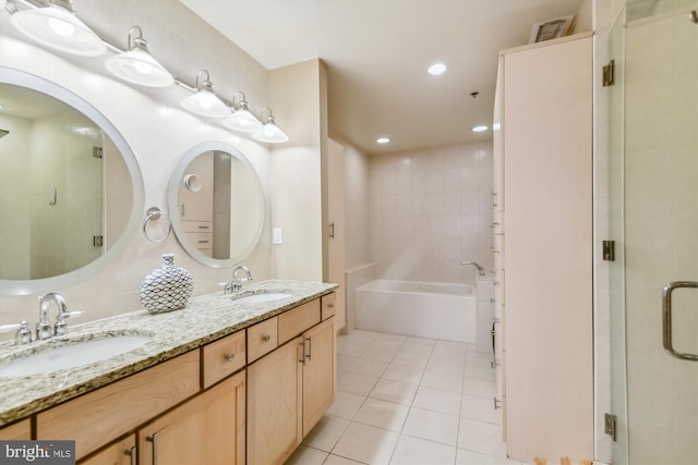 bathroom featuring vanity, separate shower and tub, and tile patterned floors