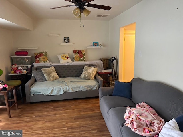 living room with hardwood / wood-style floors and ceiling fan