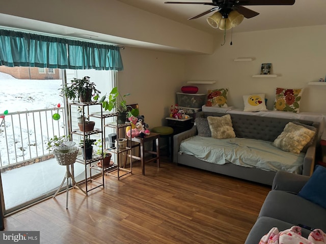 living room featuring hardwood / wood-style floors, a wealth of natural light, and ceiling fan