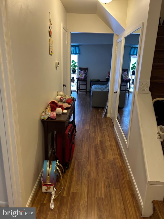 corridor featuring dark hardwood / wood-style flooring