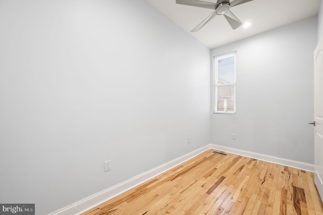 unfurnished room with hardwood / wood-style flooring and ceiling fan