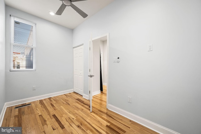 unfurnished room with ceiling fan and light hardwood / wood-style floors