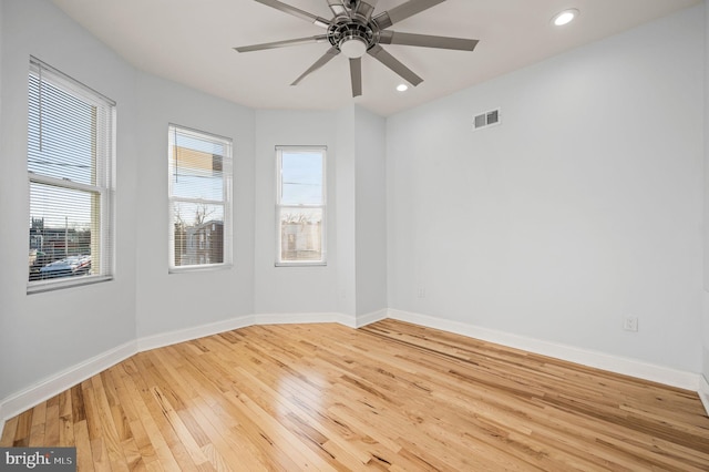 unfurnished room with ceiling fan and light hardwood / wood-style flooring