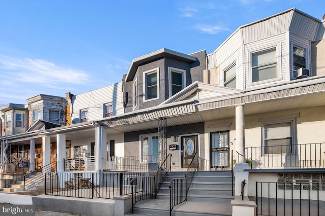 multi unit property featuring cooling unit and a porch