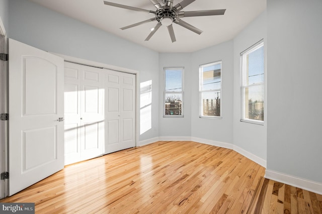 entrance foyer with wood-type flooring and ceiling fan