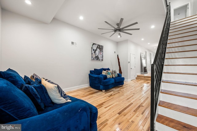 living room with hardwood / wood-style floors and ceiling fan