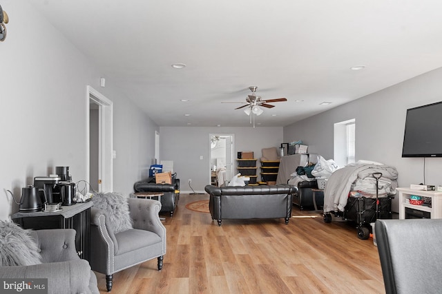 living area featuring recessed lighting, light wood-type flooring, and ceiling fan