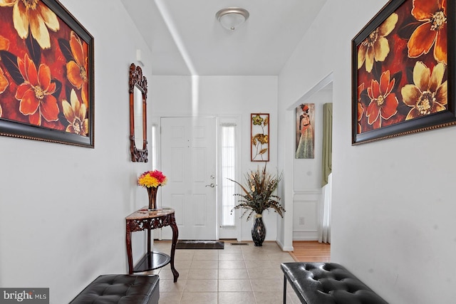 tiled entrance foyer with baseboards