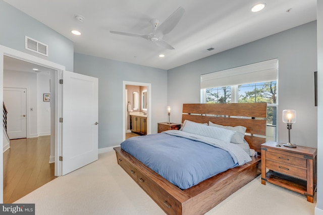 bedroom with ceiling fan and ensuite bathroom