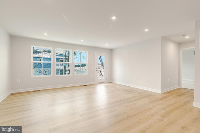 unfurnished room featuring light hardwood / wood-style flooring