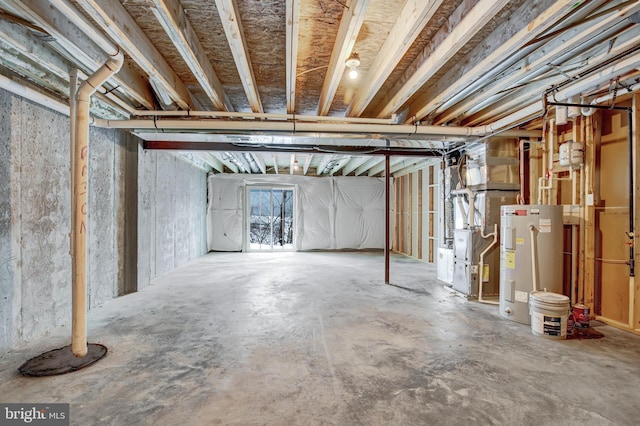 basement featuring electric water heater and heating unit