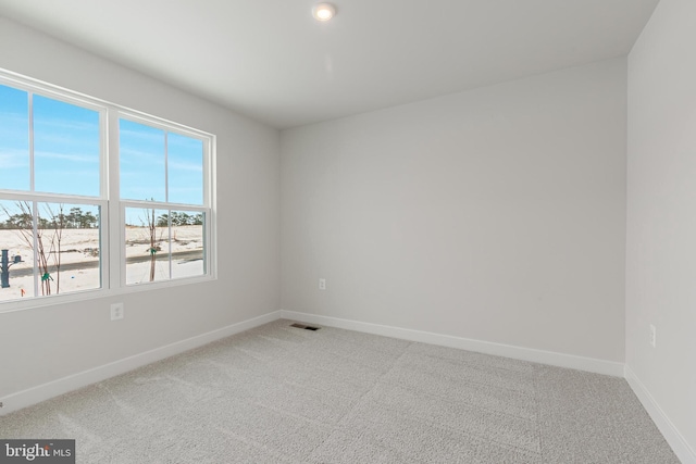 empty room featuring carpet flooring