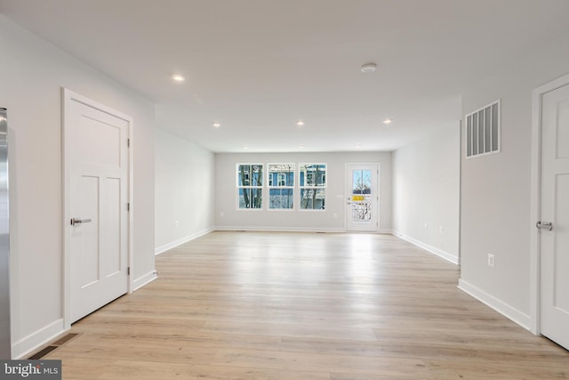 unfurnished room with light hardwood / wood-style flooring