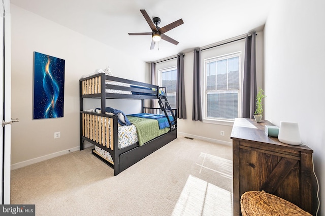 carpeted bedroom featuring visible vents and baseboards