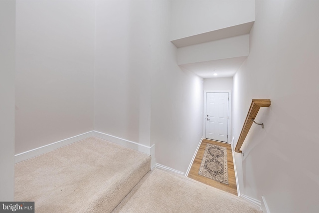 interior space with carpet floors and baseboards