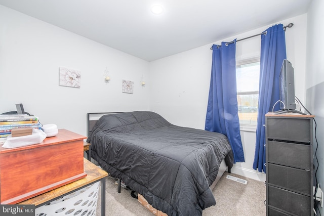 bedroom with light carpet