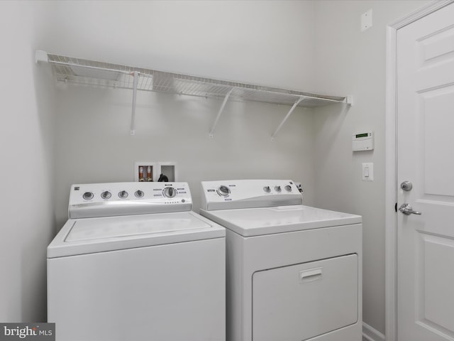 washroom with washer and dryer