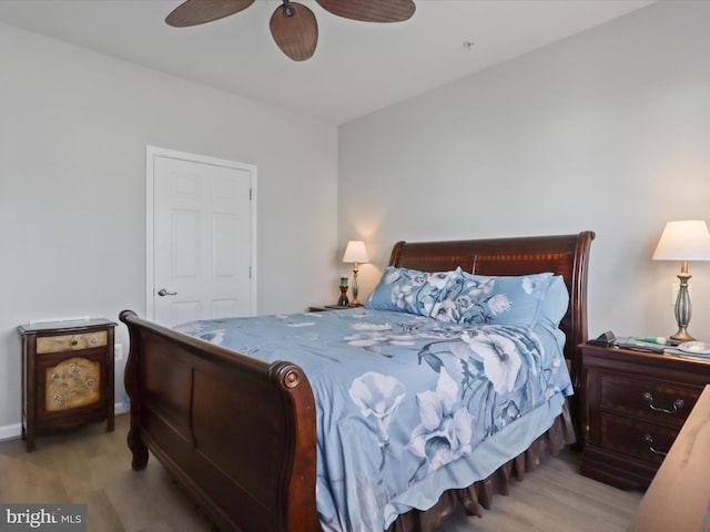 bedroom with ceiling fan and light hardwood / wood-style flooring