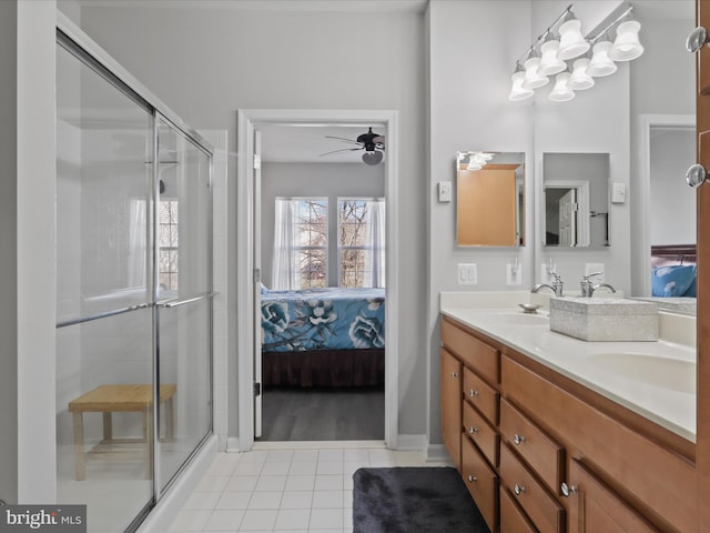 bathroom featuring tile patterned flooring, vanity, ceiling fan, and a shower with shower door