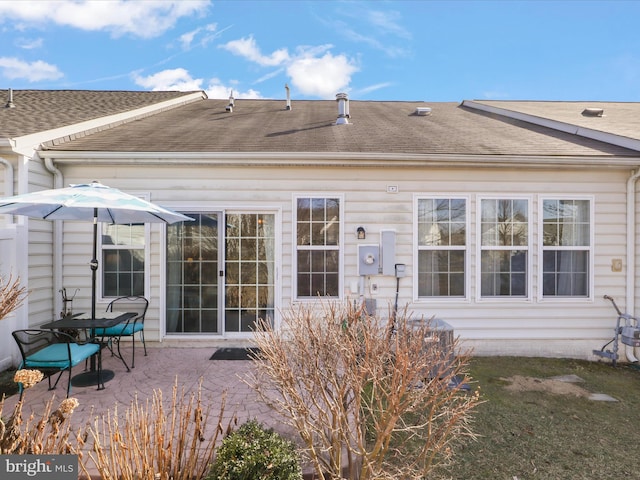 back of house with a patio