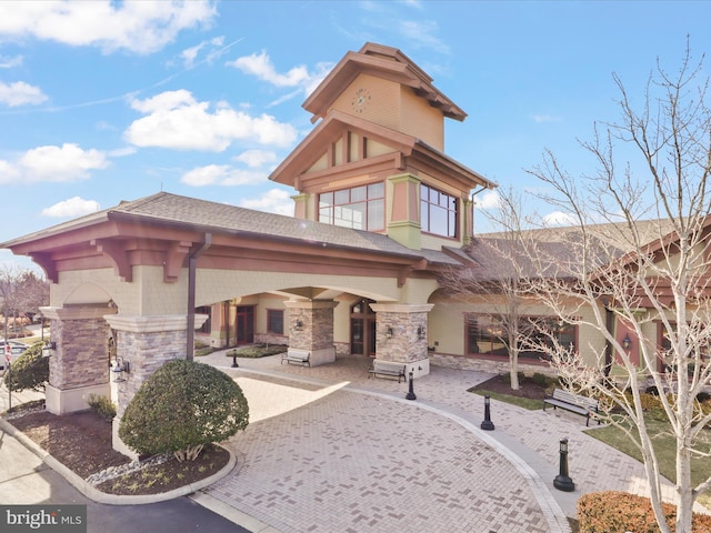 exterior space featuring a fireplace and a patio