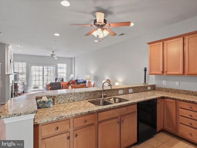 kitchen with sink, light stone counters, light tile patterned floors, black dishwasher, and kitchen peninsula