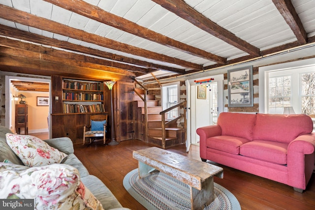 living room with dark hardwood / wood-style flooring, wood ceiling, and beam ceiling