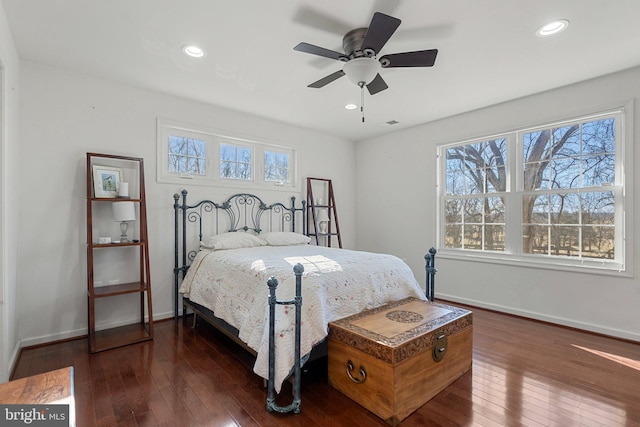 bedroom with dark wood-type flooring and ceiling fan