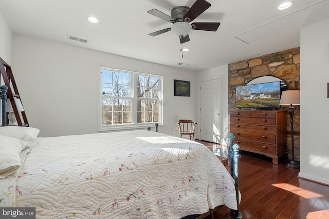 bedroom featuring ceiling fan and dark hardwood / wood-style flooring