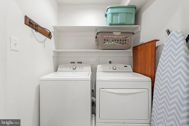 laundry area featuring washing machine and clothes dryer