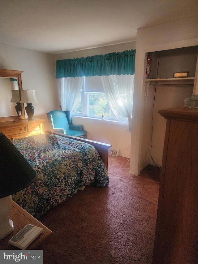 bedroom featuring a closet and carpet flooring