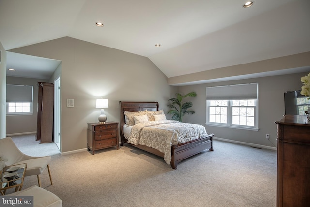 bedroom with light carpet, recessed lighting, baseboards, and vaulted ceiling