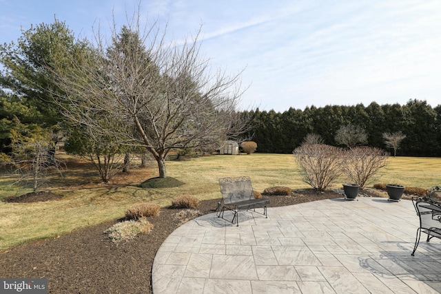 view of patio / terrace with an outbuilding