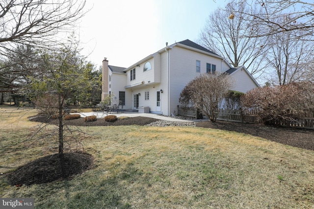 back of property with a patio, fence, a yard, a chimney, and central air condition unit