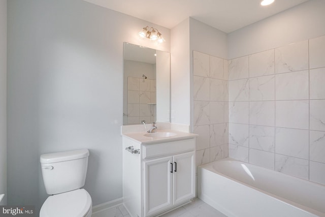 full bathroom featuring vanity, tiled shower / bath, and toilet