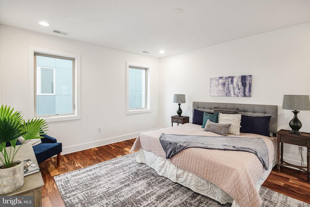 bedroom featuring dark hardwood / wood-style flooring