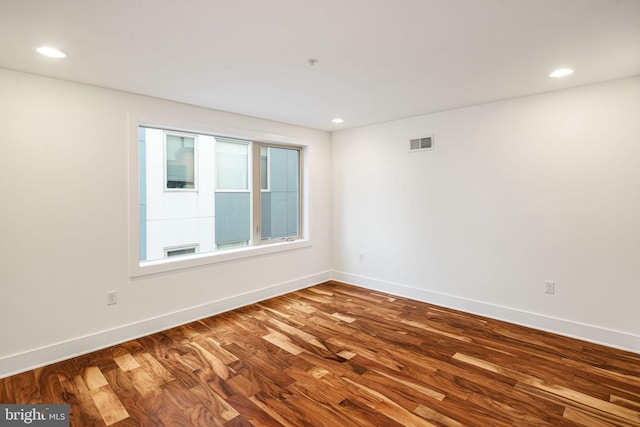 unfurnished room featuring hardwood / wood-style floors