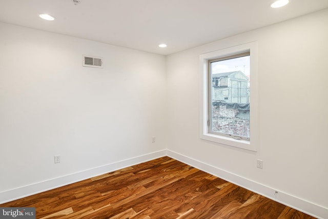 spare room featuring hardwood / wood-style flooring