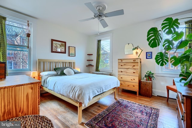 bedroom featuring ceiling fan and wood finished floors