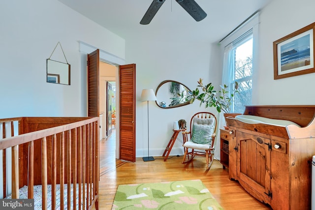 interior space with baseboards and light wood-style flooring