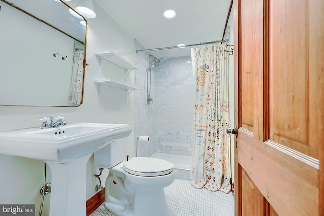 bathroom with toilet, recessed lighting, and a stall shower