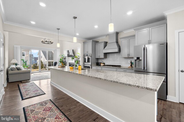 kitchen with premium range hood, stainless steel appliances, gray cabinets, and light stone countertops