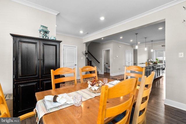 dining room with ornamental molding and dark wood-type flooring