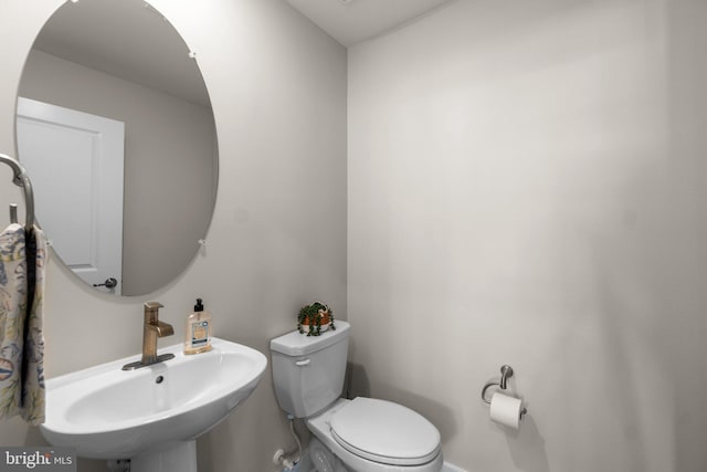 bathroom featuring sink and toilet