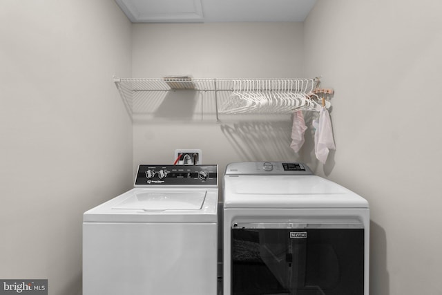 laundry area with washer and clothes dryer