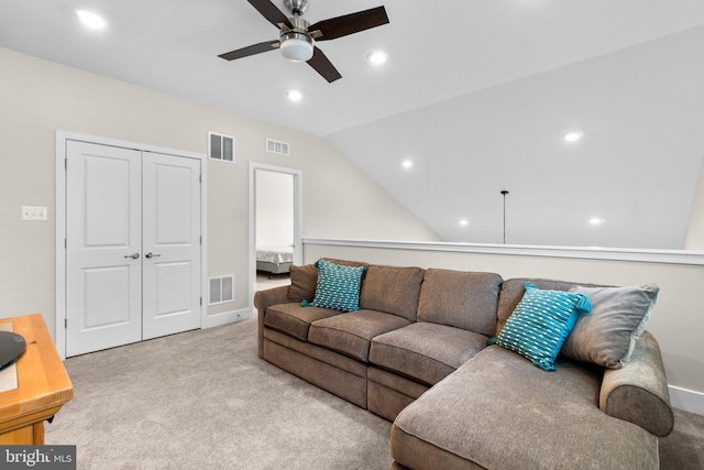 living room with light carpet, vaulted ceiling, and ceiling fan