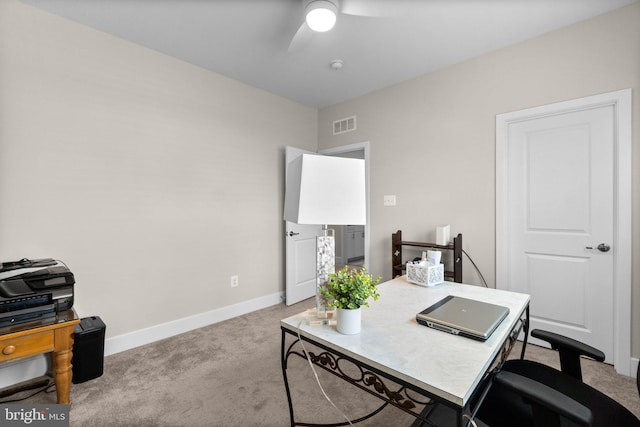 carpeted office with ceiling fan