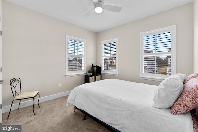 bedroom featuring light carpet and ceiling fan