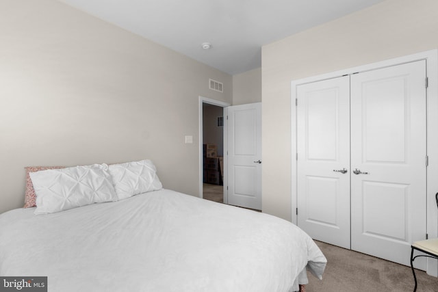 bedroom with a closet and carpet